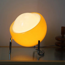 VivaGlow - Playful Table Lamp with Spherical Shade and Curved Base