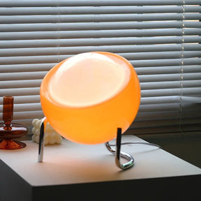 VivaGlow - Playful Table Lamp with Spherical Shade and Curved Base